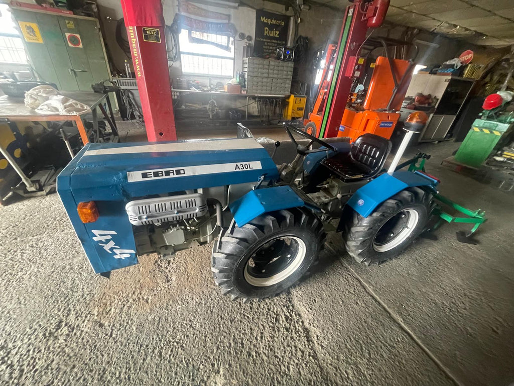 Pack tractor EBRO A30L 4x4 restaurado + cultivador 5 brazos